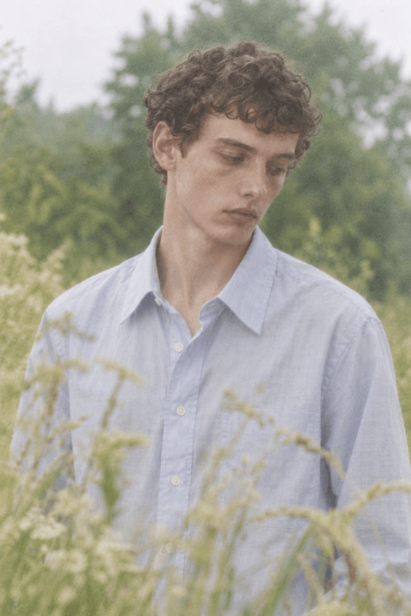 Utility campaign , pale blue shirt